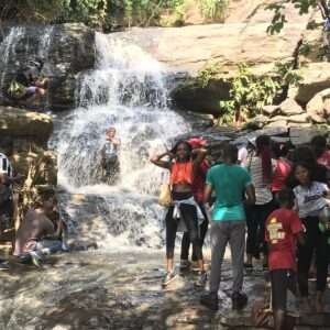 people having fun at the karu waterfall